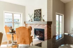 Brick_fireplace_with_shiplap_above_